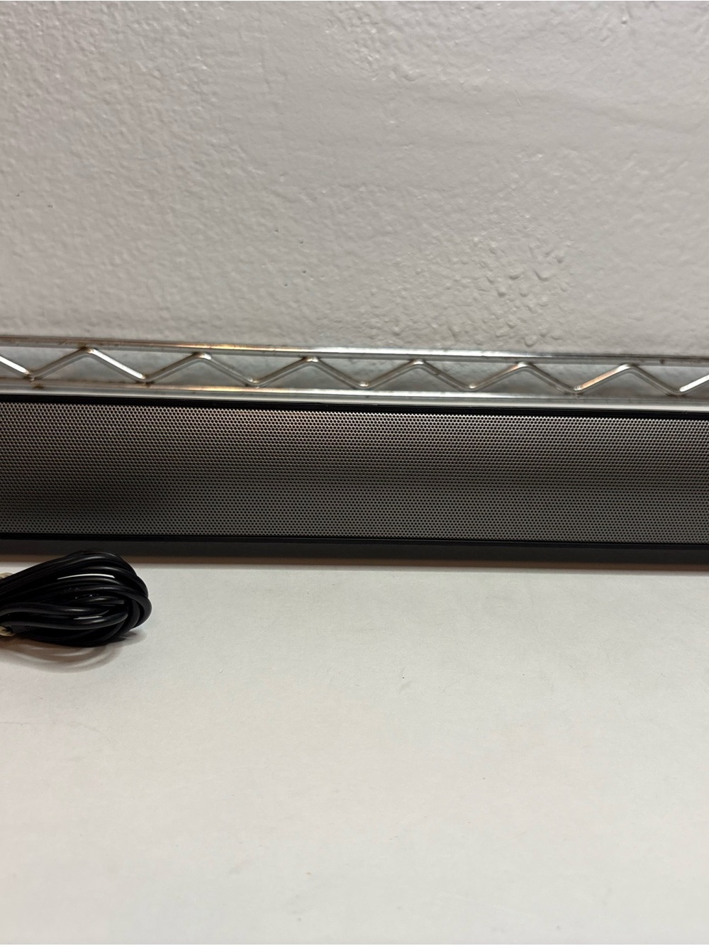 Compact Black Soundbar with Wired Cable